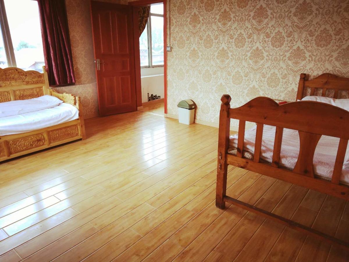 Zishuo Zihua Guest House Daocheng Exterior photo